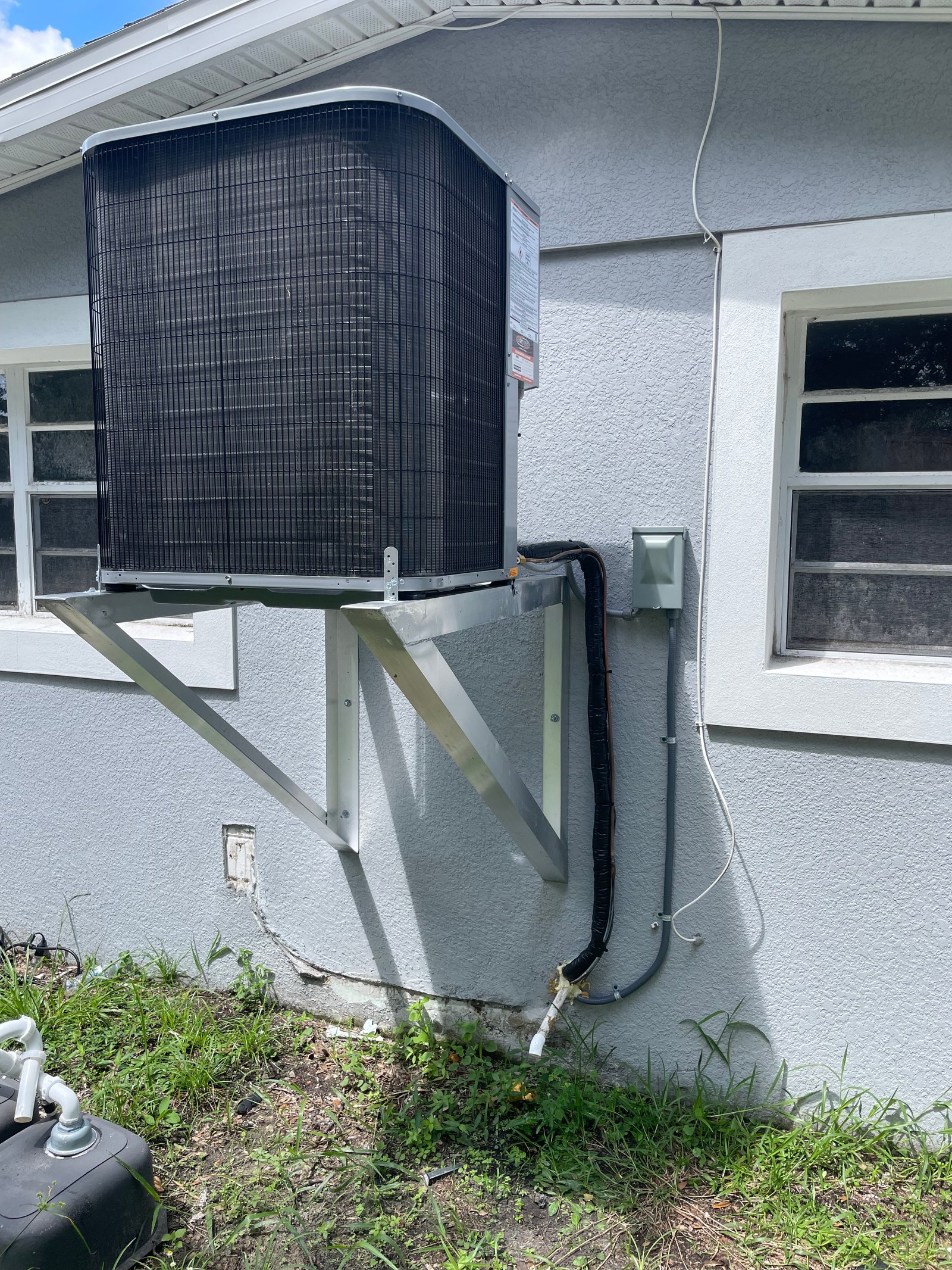 Wall-mounted split air conditioner in a modern interior, actively cooling the room with fresh airflow.